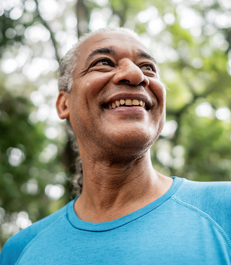Happy patient enjoying clear vision and an active lifestyle outdoors.