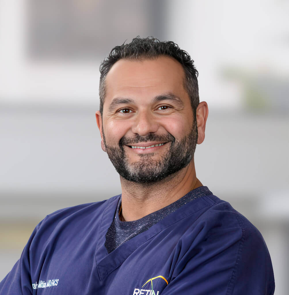Portrait of Scott C. Jamerson, MD, FACS, retina specialist in blue medical scrubs.